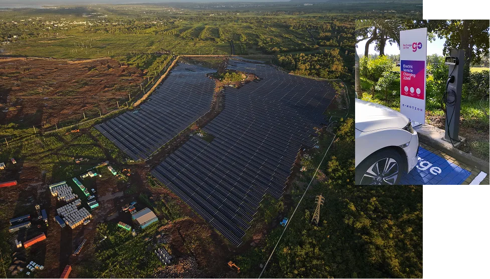 Aerial view of a solar farm and an electric vehicle charging station